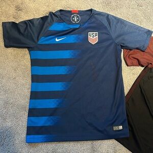 2 Nike Youth USA soccer jerseys.  Size youth XL.